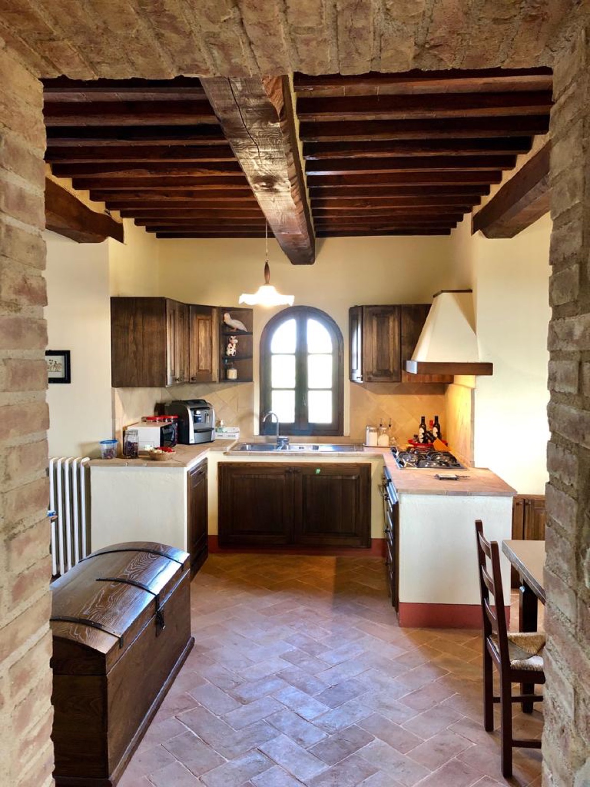 Montecucco — the stone kitchen beneath beamed ceilings